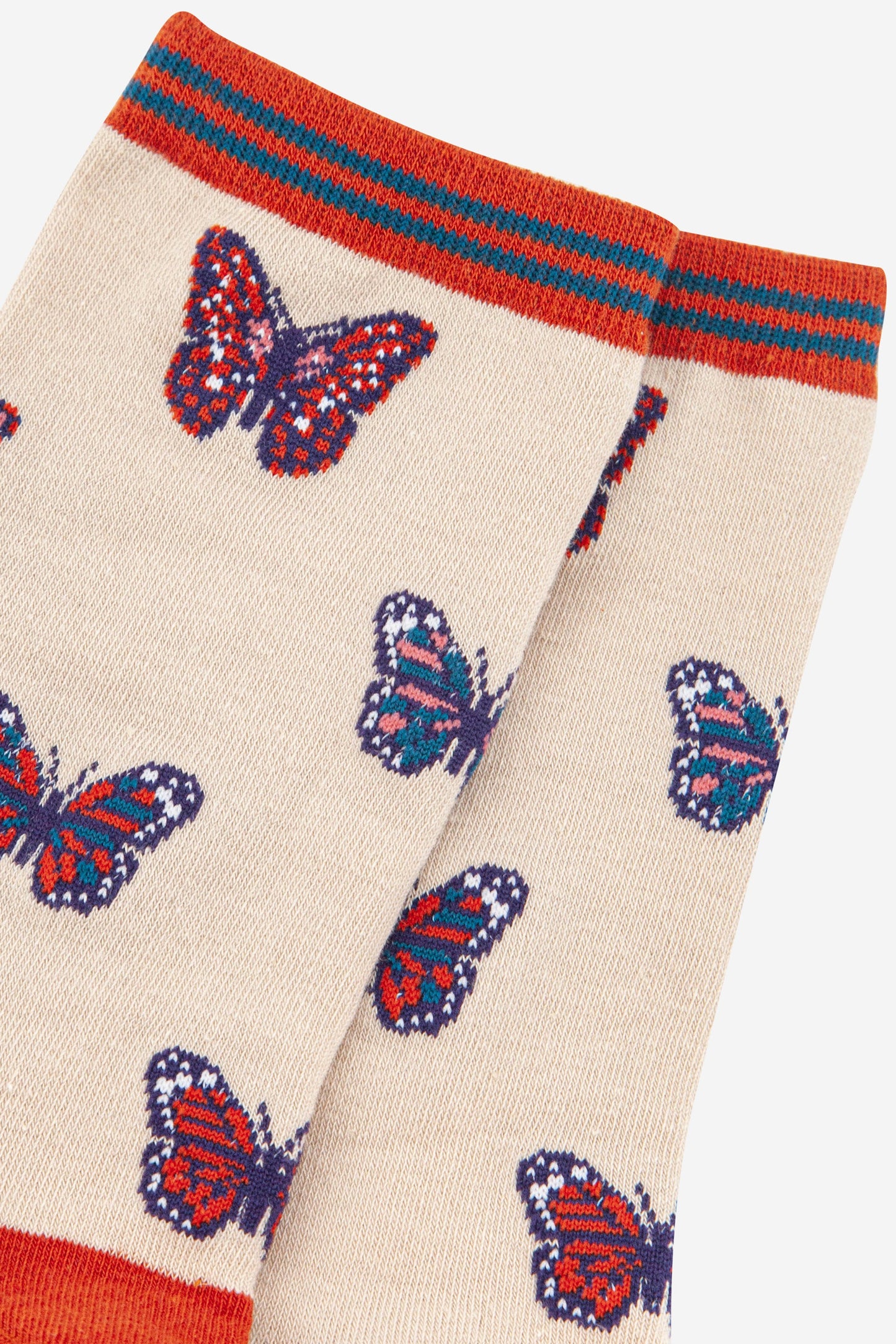 close up of the multi-coloured butterfly pattern on the ankle socks