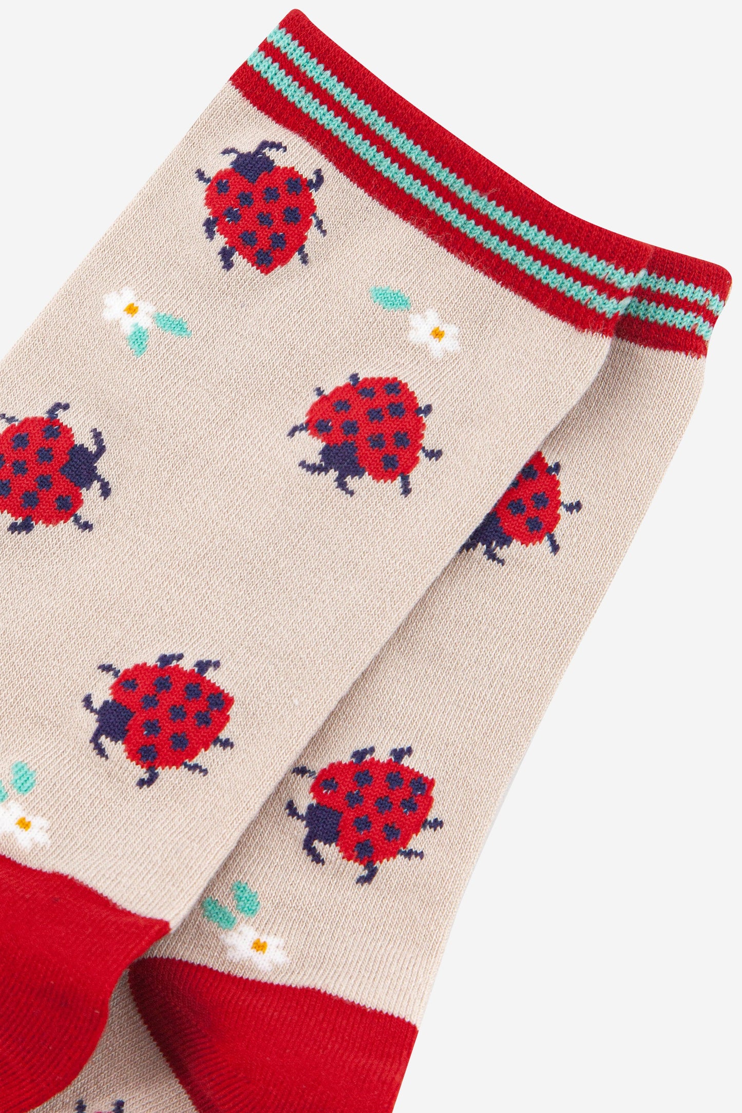 close up of the red ladybug pattern on the bamboo ankle socks