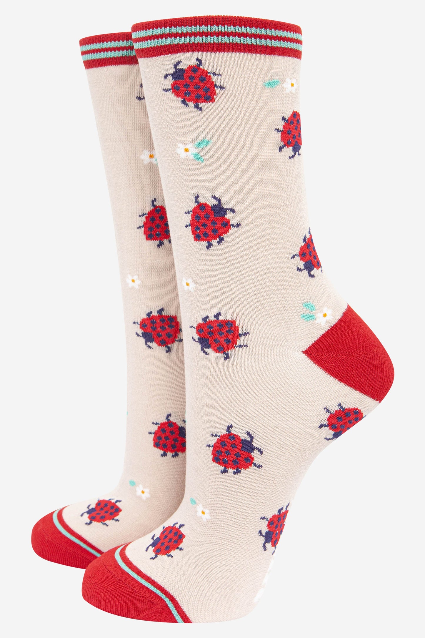 cream and red bamboo ankle socks with a pattern of red heart shaped lady bugs and daisies