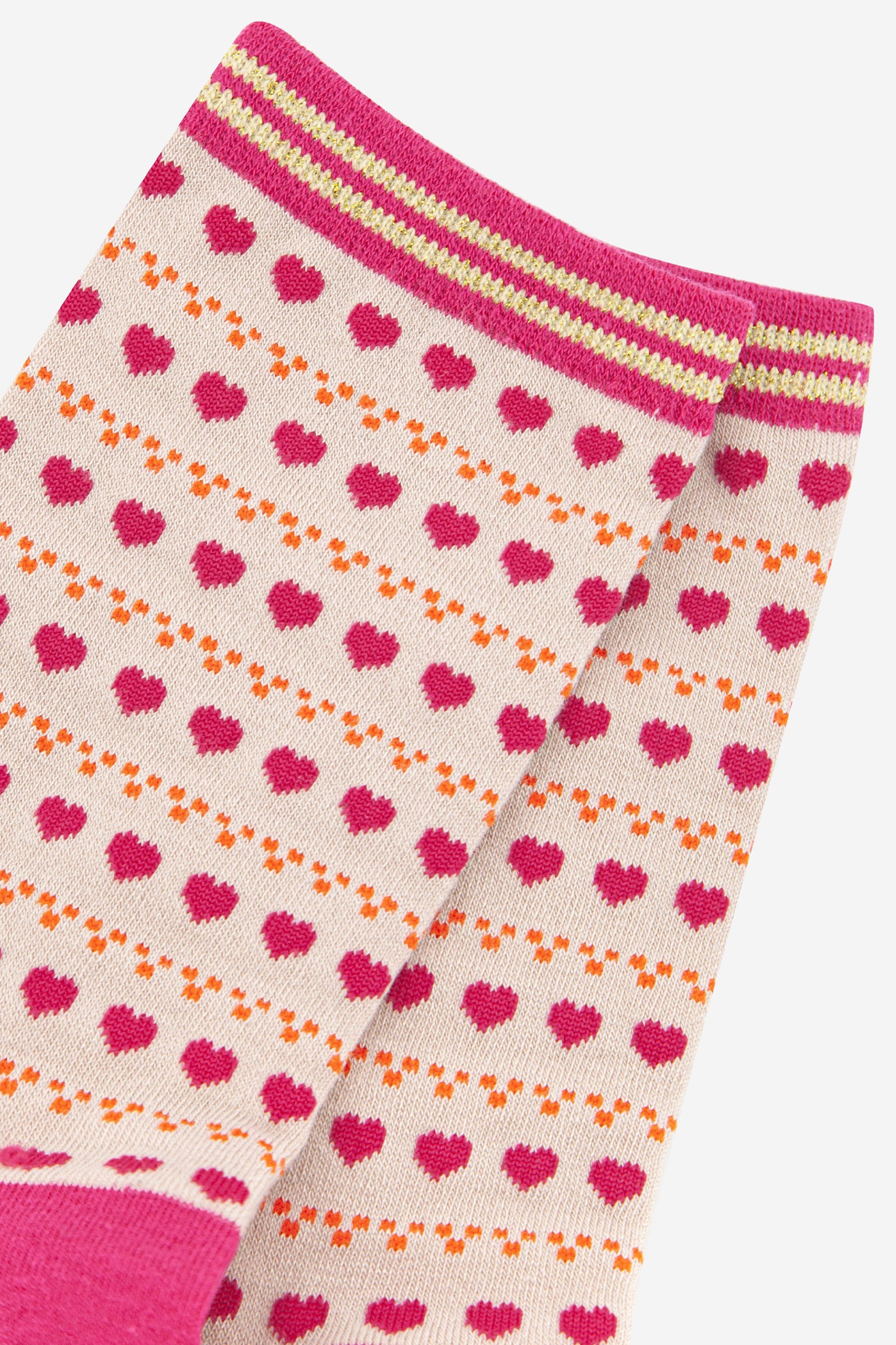 close up of the pink love heart patten on the bamboo ankle socks
