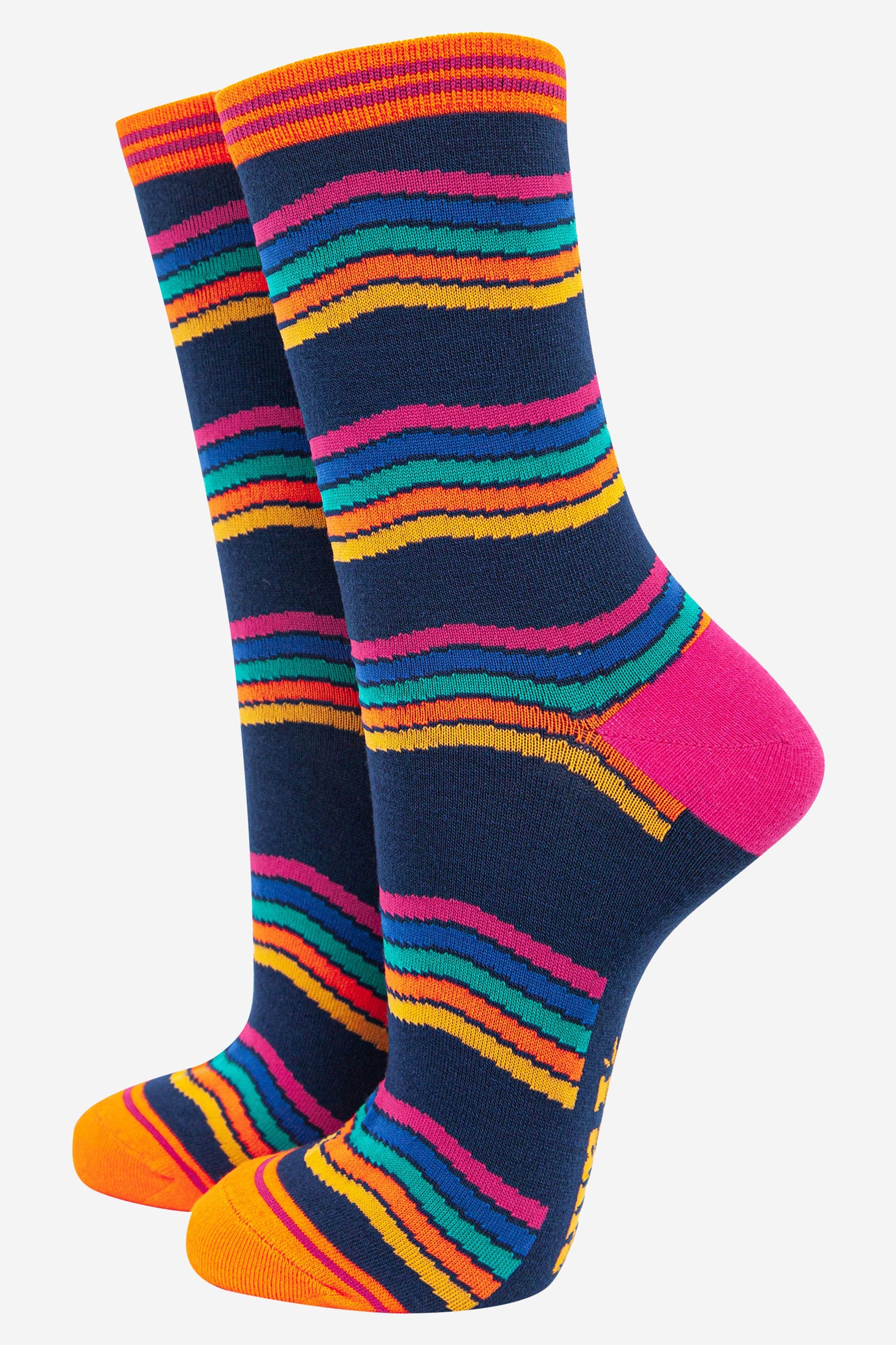 navy blue bamboo socks with a wavy rainbow stripe pattern in pink, blue, orange and yellow