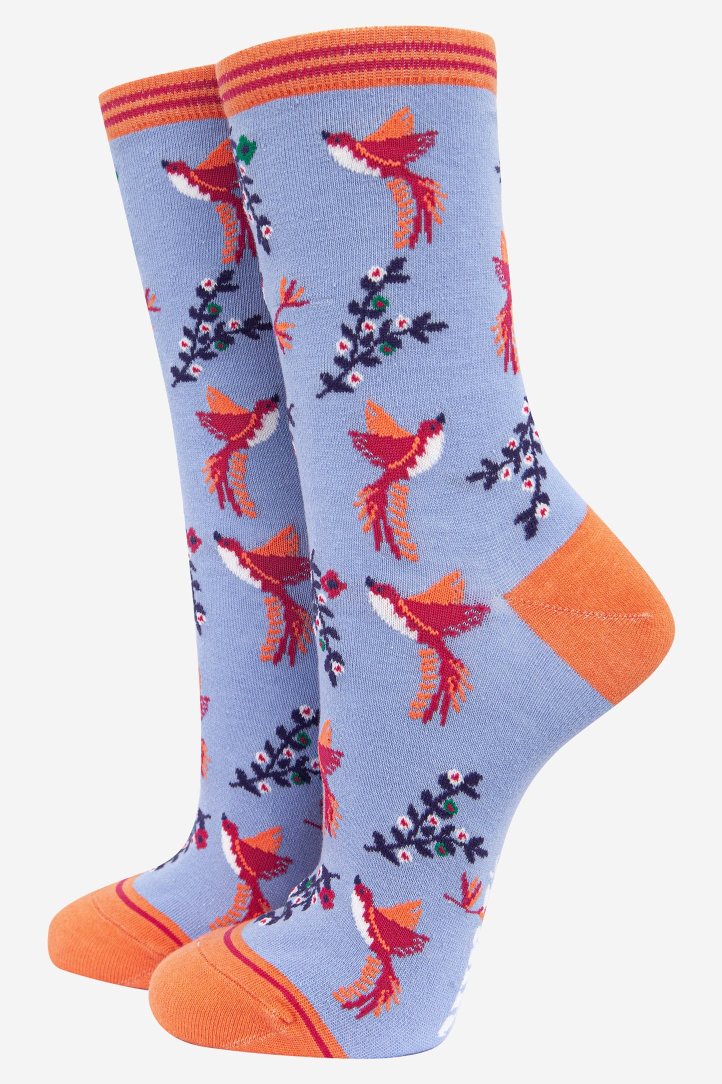 lilac blue ankle socks with orange toe and heel featuring a pattern of pink and orange hummingbirds and floral vines