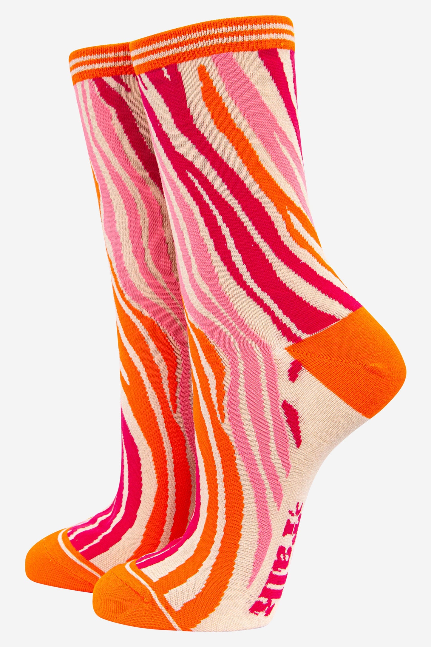 bamboo ankle socks with an all over zebra print pattern in orange and pink