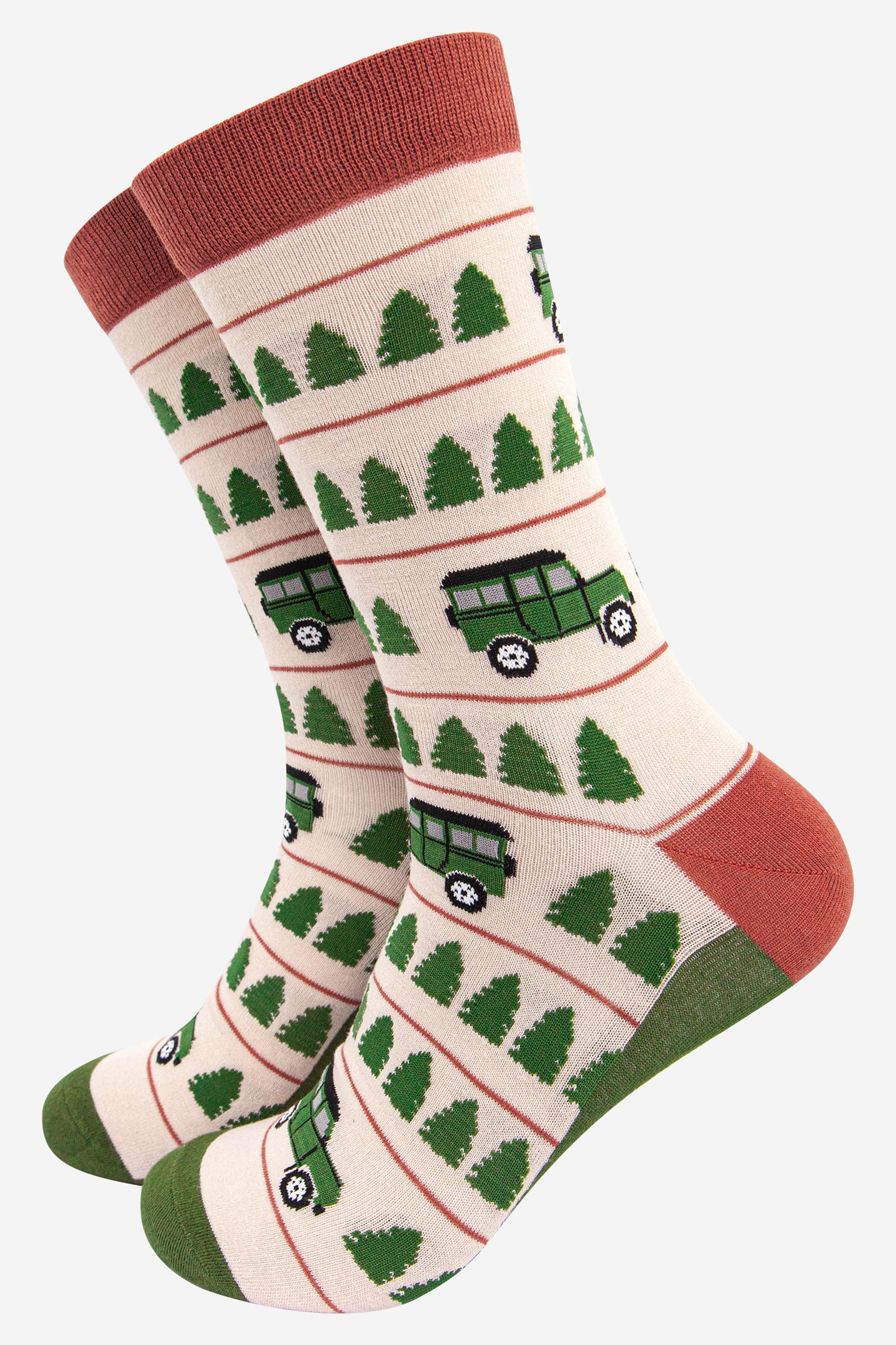 cream socks with a burnt orange cuff and heel with a green toe and sole and a pattern of green trees and jeep vehicles