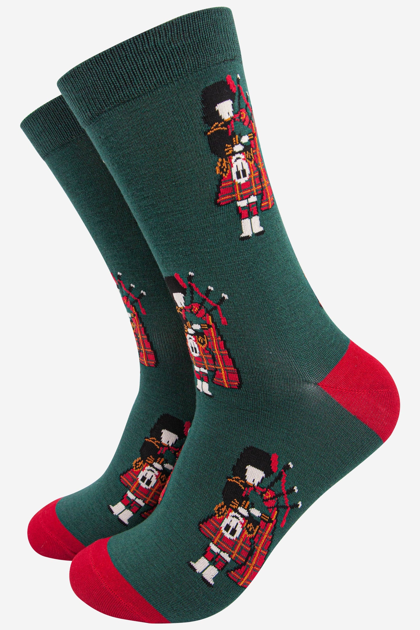 mens green bamboo socks featuring a scottish bagpipe player wearing a traditional red kilt