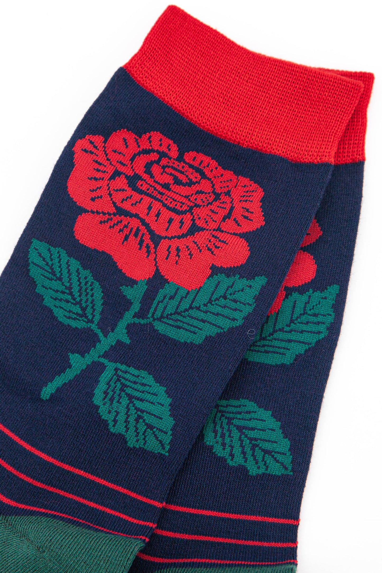 close up of the traditional red english rose on the ankle of the mens dress socks