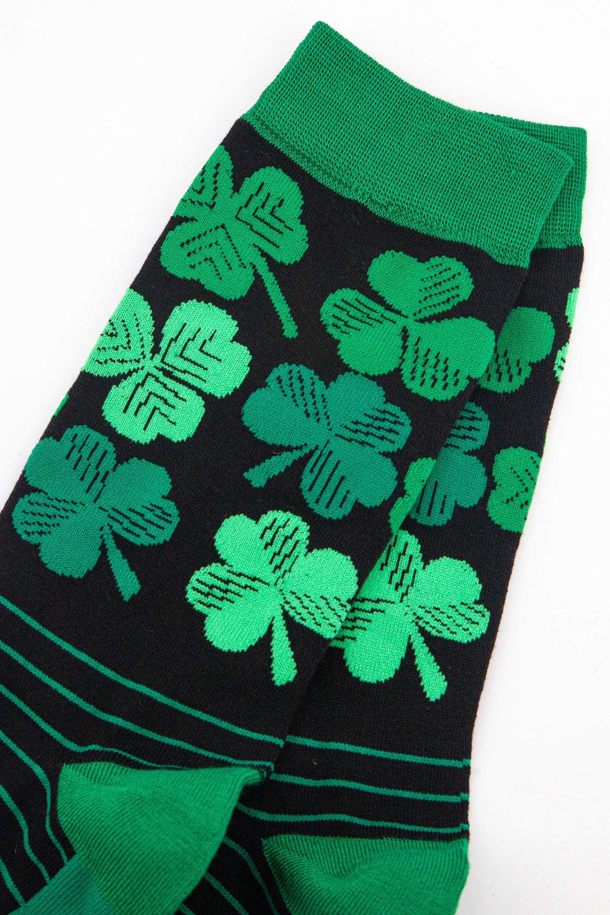 close up of the green Irish shamrock pattern on the ankle of the socks