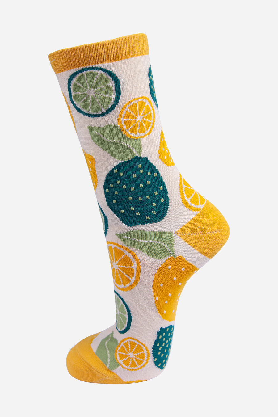 cream and yellow bamboo socks with an all over pattern of limes and lemon fruits