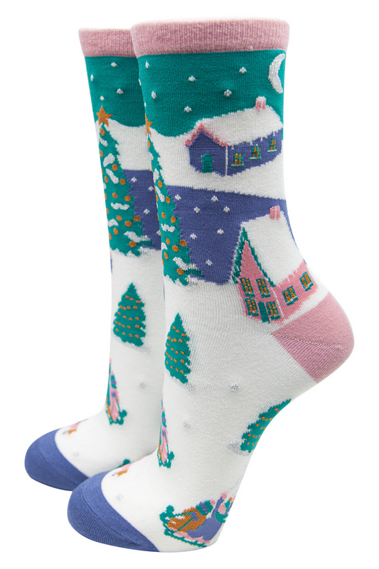 ladies bamboo ankle socks in green, pink and blue, designed to look like a winter village