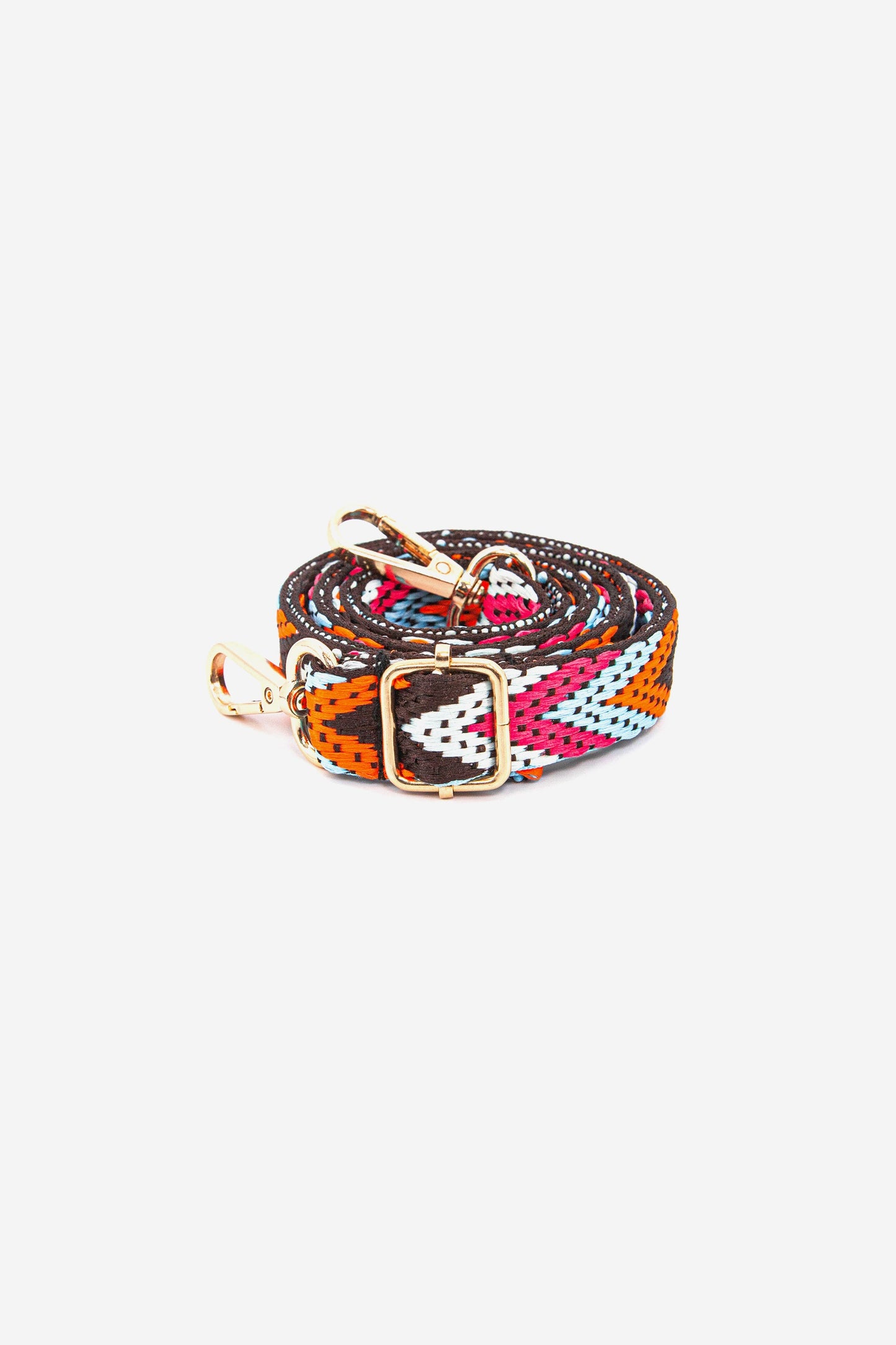 close up of the bold multicoloured chevron pattern and adjustable gold buckle