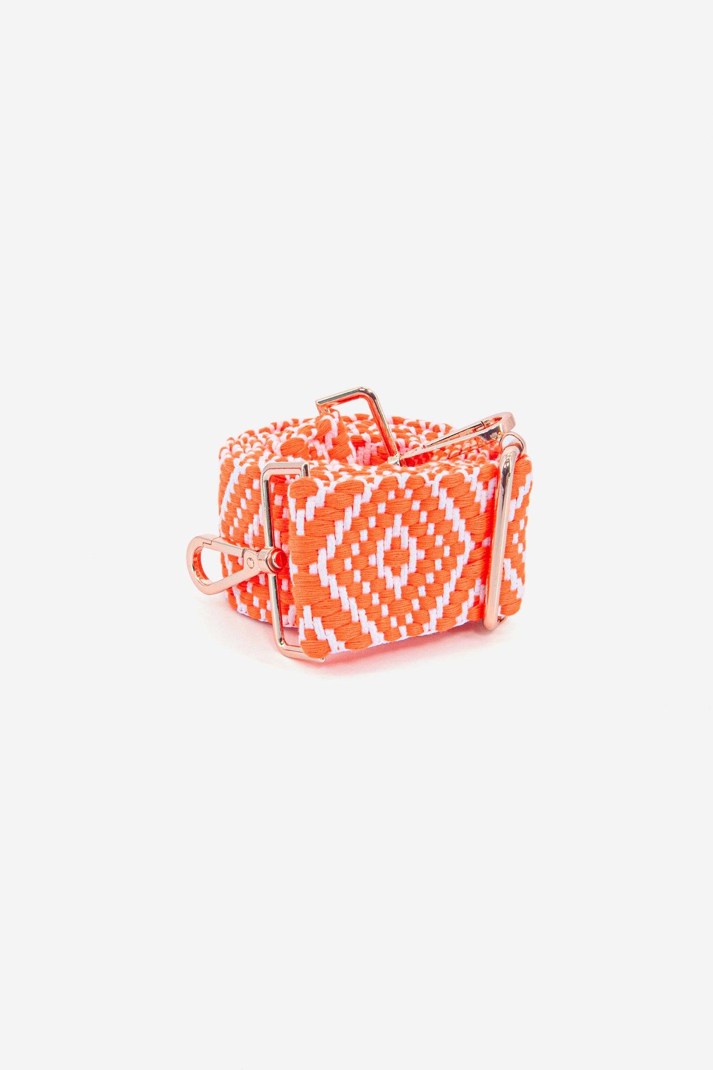 showing the bag strap curled up, highlighting the orange and white ikat pattern