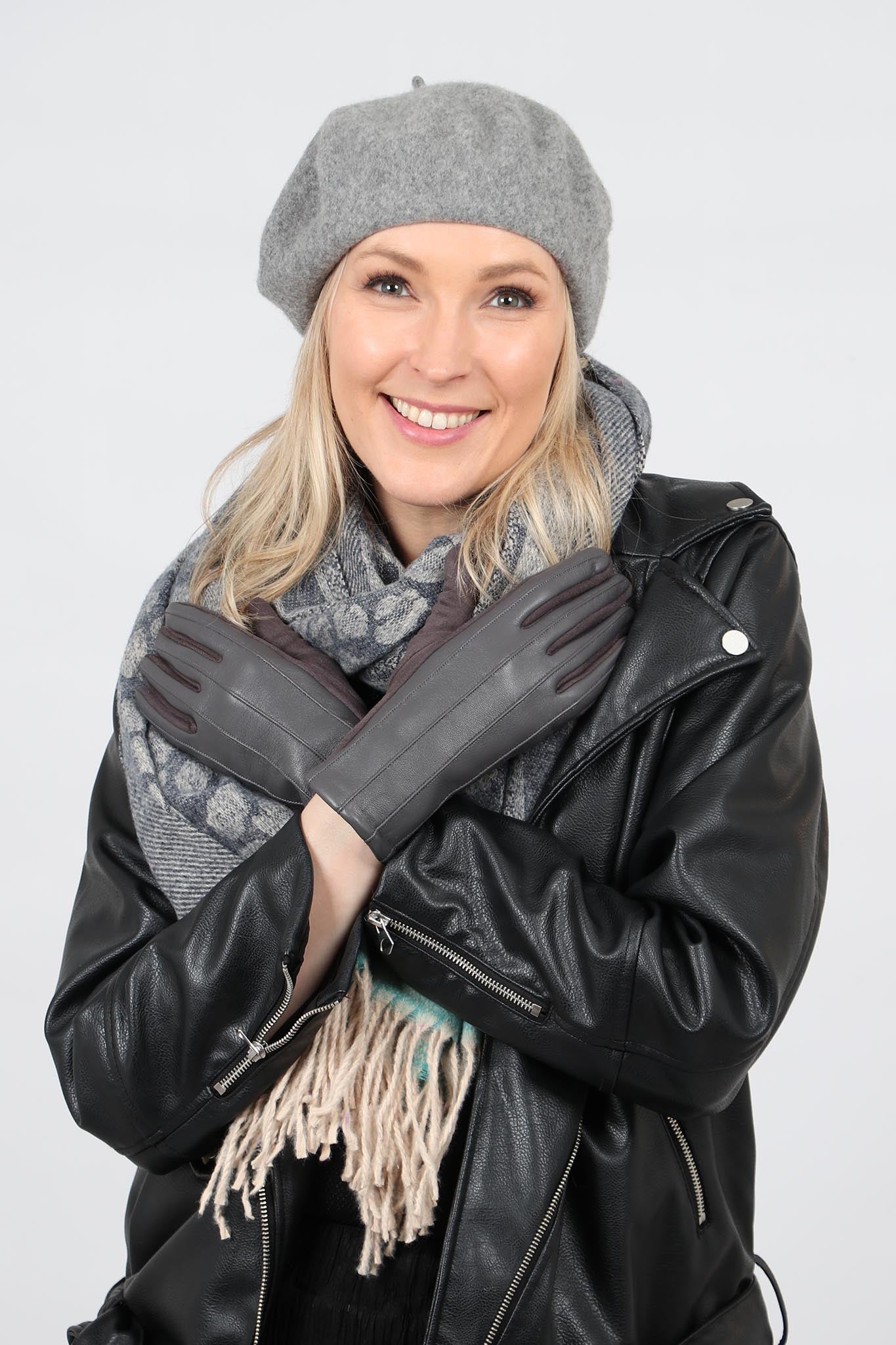 model wearing a grey beret hat with other winter accessories