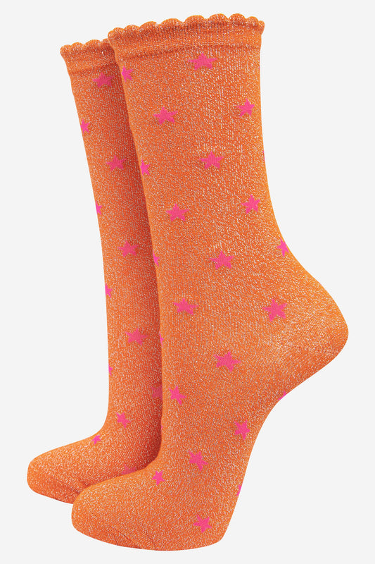 orange glitter ankle socks with an all over pink star pattern and scalloped cuffs