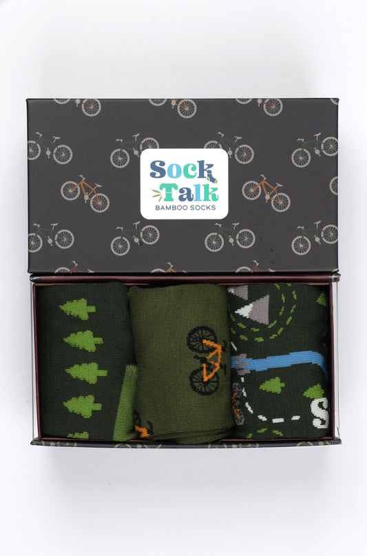 an artistically designed gift box with bicycles on it with three pairs of green mountain bike themes mens bamboos socks