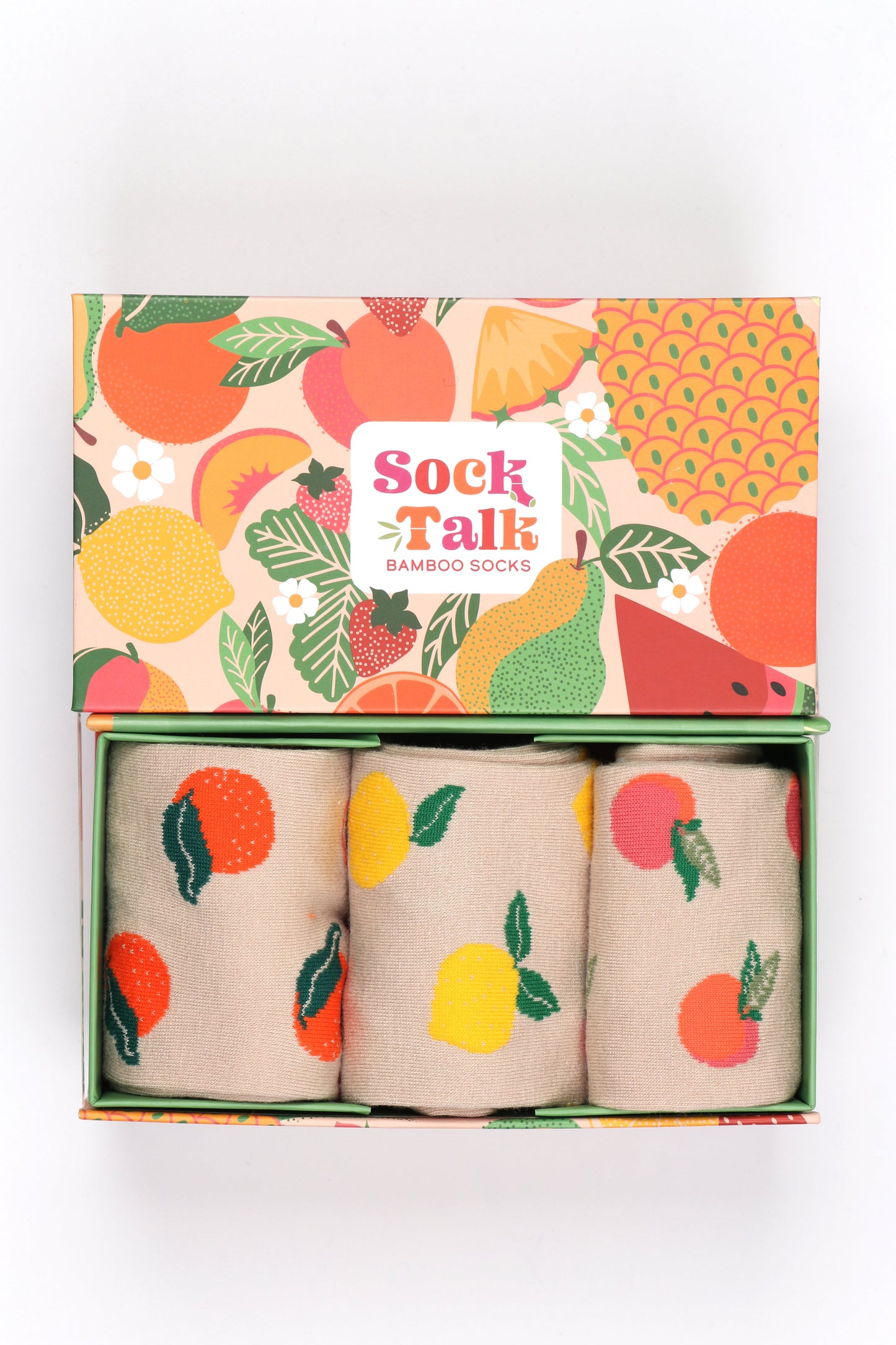 fruit patterned gift box with three pairs of ladies bamboo fruit socks featuring peaches, oranges and lemons