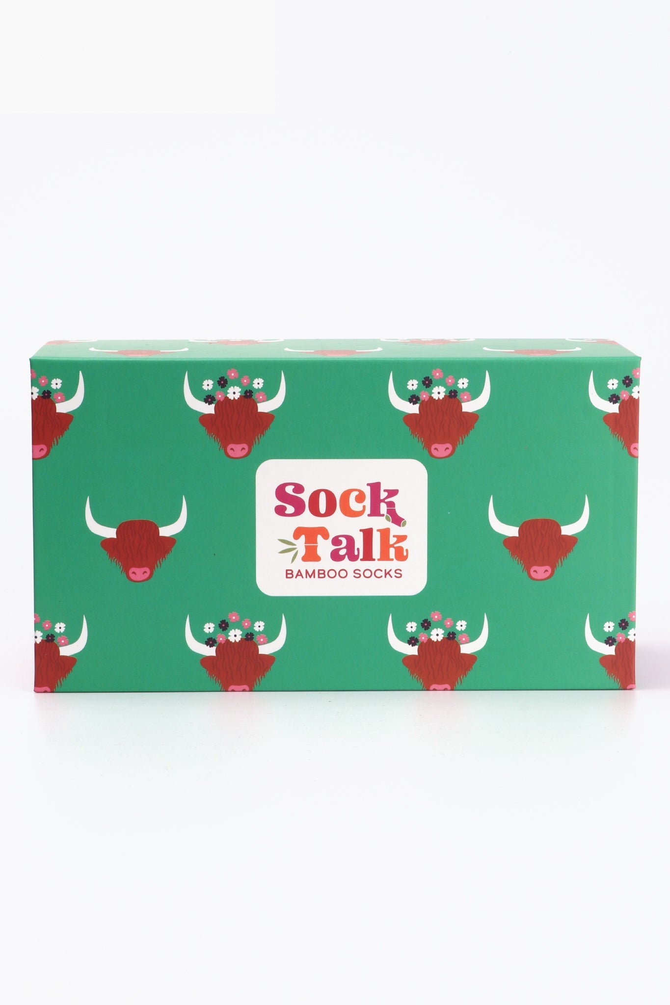 green sock talk gift box with a pattern of highland cows wearing floral wreath crowns