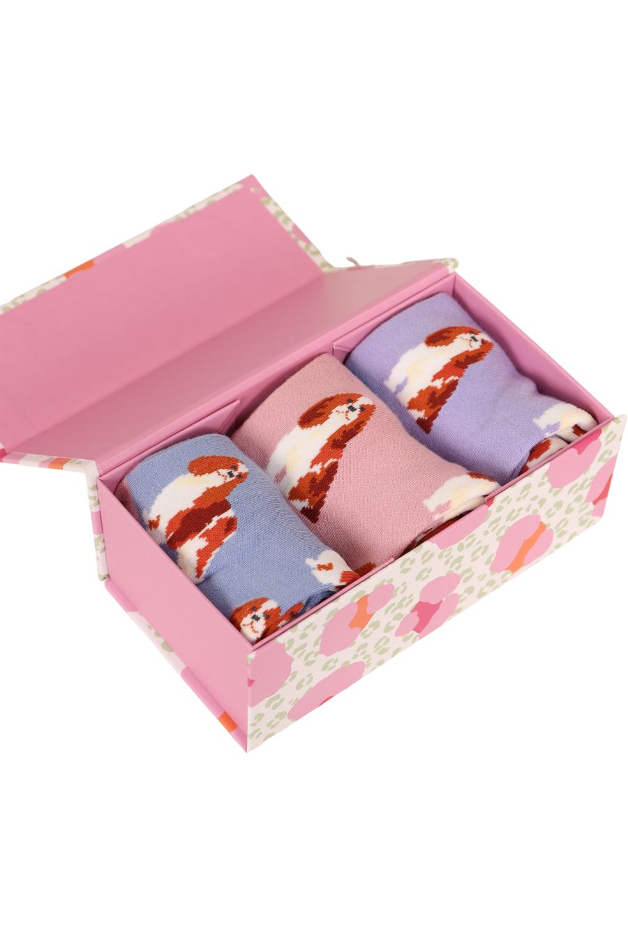 An open gift box showing three colours of Cavalier Spaniel socks, Pink, Purple and Lilac