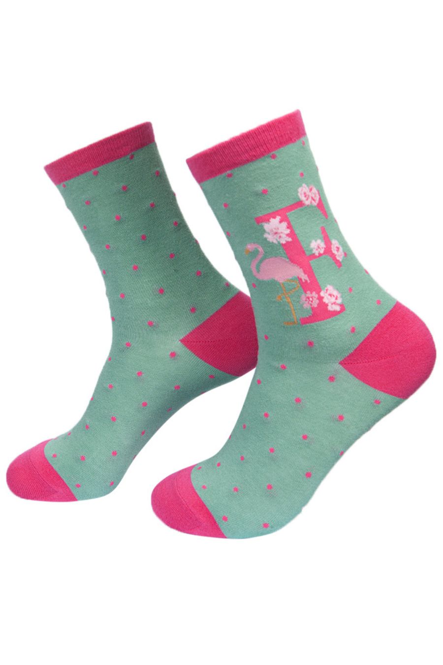 green, pink bamboo socks with the letter F and a flamingo
