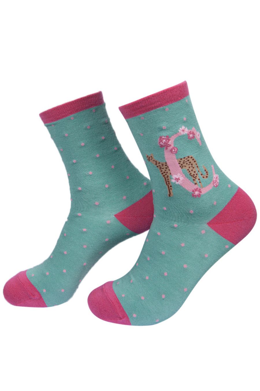 green, pink bamboo socks with a letter C and a cheetah