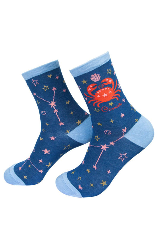 blue bamboo socks depicting the zodiac sign of cancer the crab with it's constellation