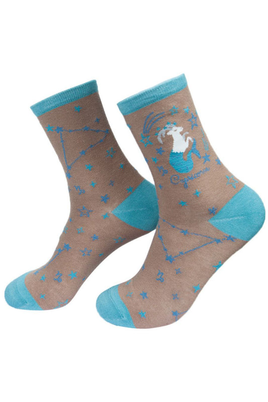 grey, blue ankle socks with the zodiac sign and celestial constellaion of capricorn