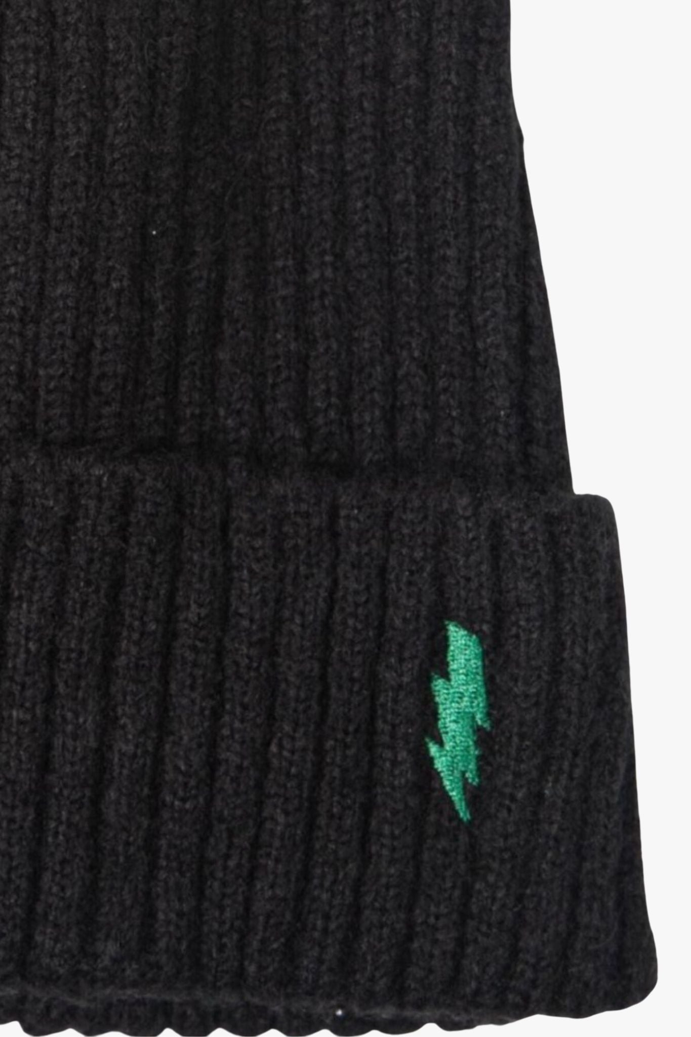close up of the green embroidered lightning bolt and ribbed knitted fabric