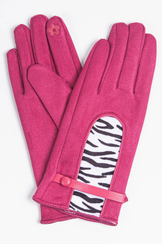 fuchsia pink velvet gloves with a black and white zebra print panel on the back